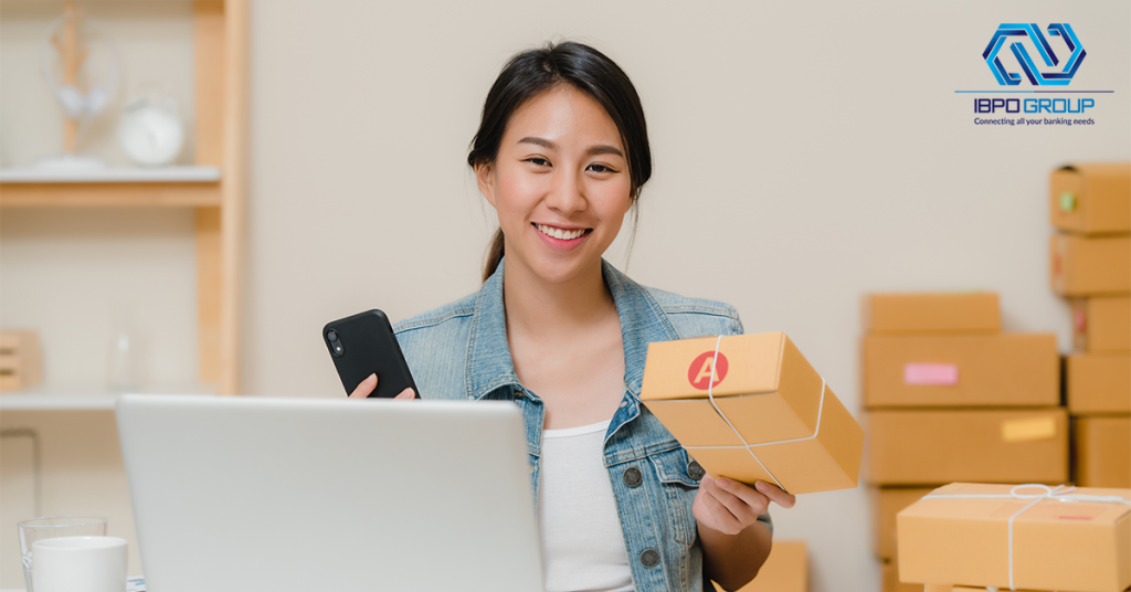 beautiful-smart-asian-young-entrepreneur-business-woman-owner-sme-checking-product-stock-scan-qr-code-working-home